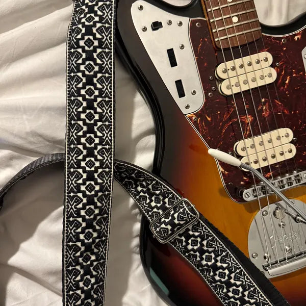 Embroidered guitar strap with black and white colors
