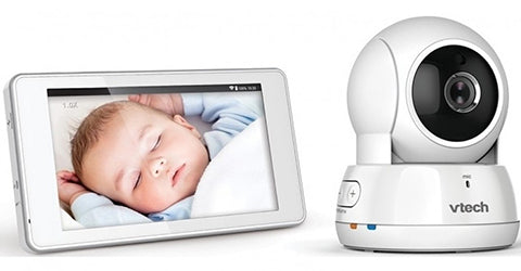 VTech baby monitor camera and screen showing baby sleeping