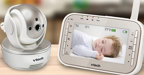 a baby vtech camera with screen showing baby sleeping