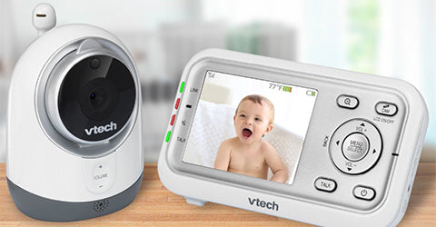 baby monitor and camera on a desk