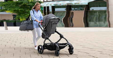 mother moving a pushchair
