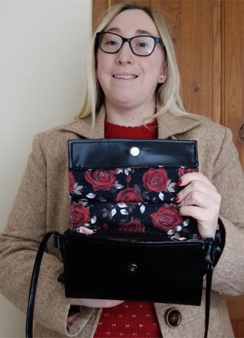 Emma holding the Rosa Black Janine Crossbody