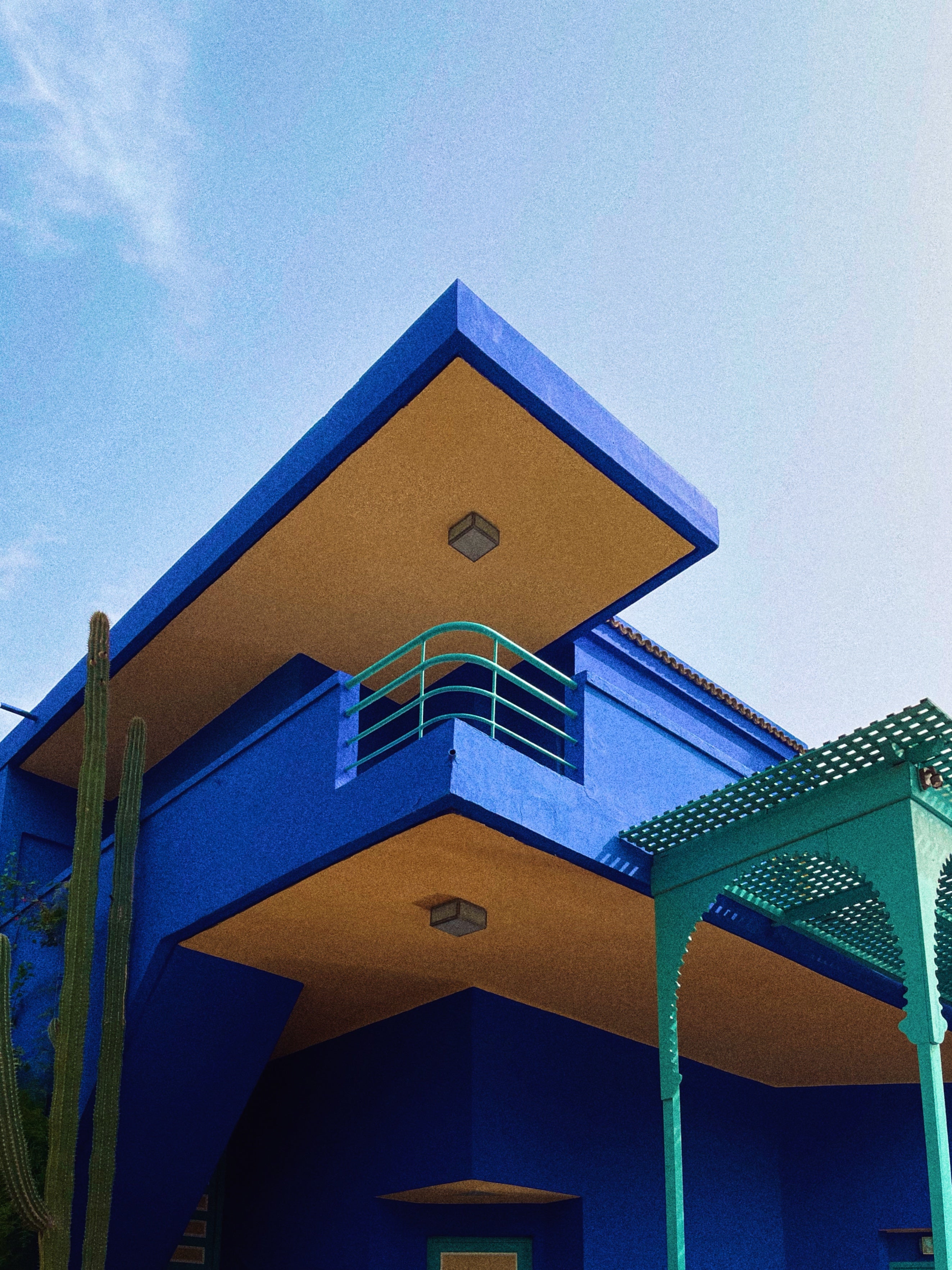 House at Le Jardin Majorelle in Marrakech, bright blue building with tropical garden