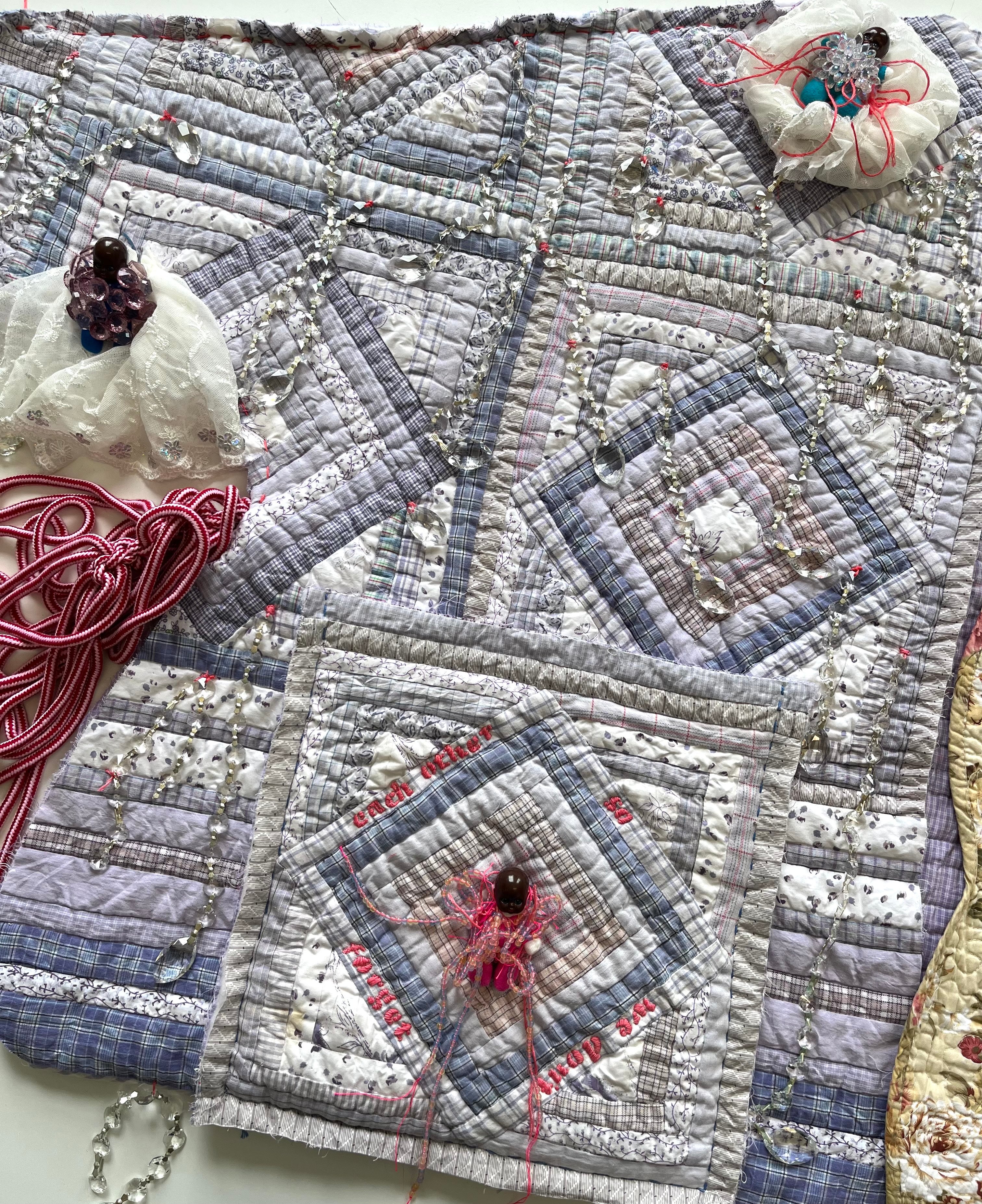 Quilted artwork by Dr. Sequoia Barnes entitled So We Don’t Forget Each Other, Phase 1 (2022), ‘coat’ made of recycled quilts, fabric remnants, rope, and found objects.