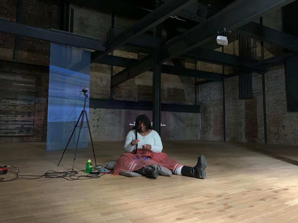 Still from amplified stitching performance at Fruitmarket, May 2022, by Dr. Sequoia Barnes