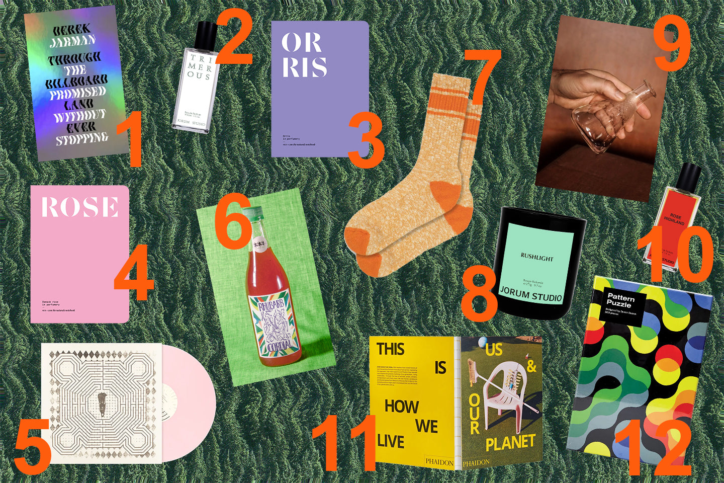 Jorum Studio Gift Guide 2023 featuring gifts arranged on a background of distorted green trees