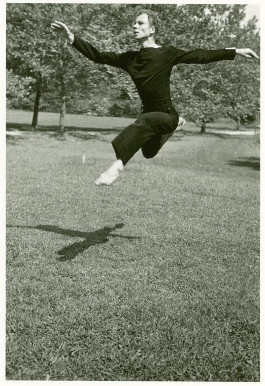Archival photograph of choreographer merge Cunningham mid-leap
