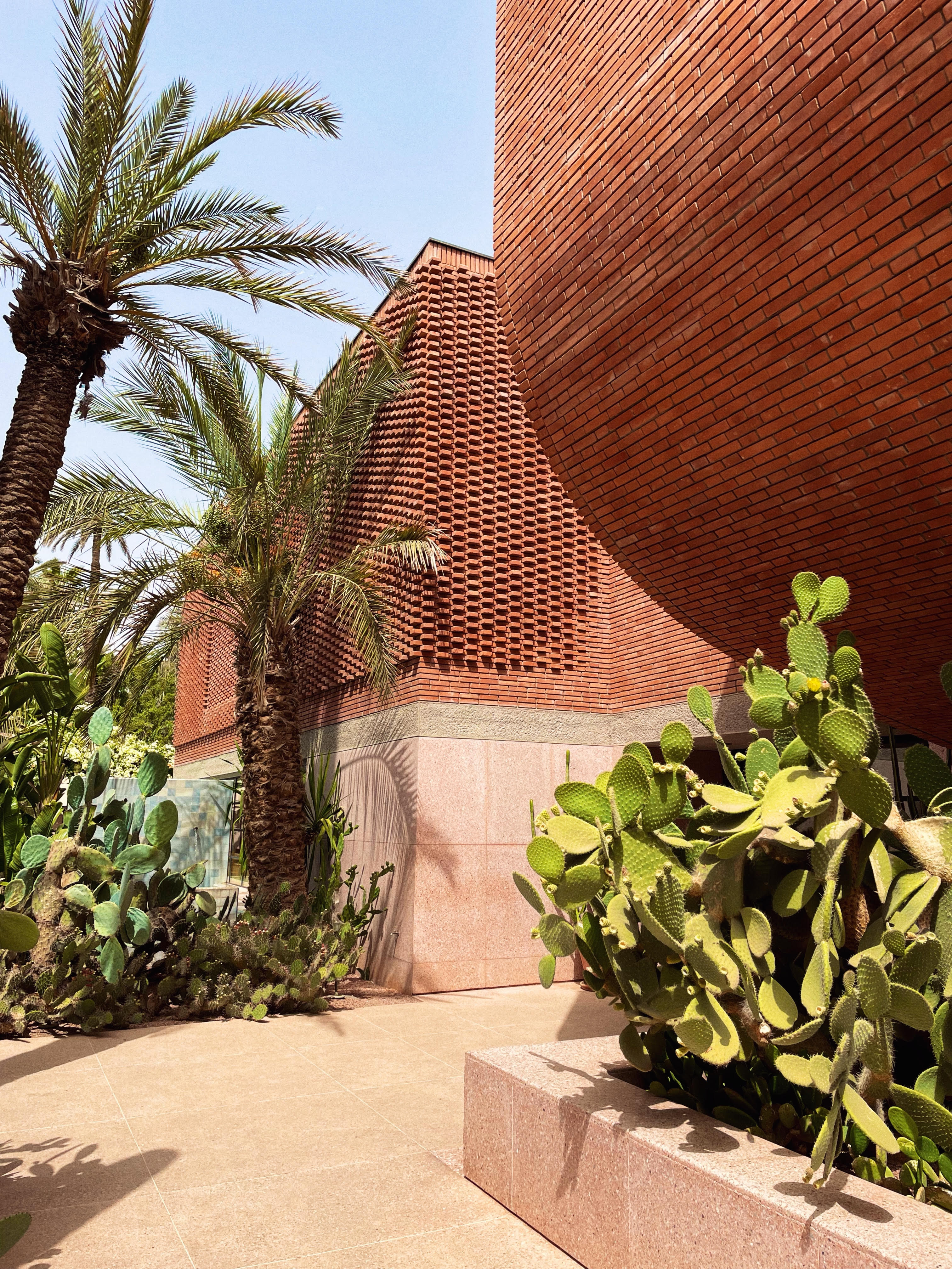 Musée Yves Saint Laurent, red brick building with cacti