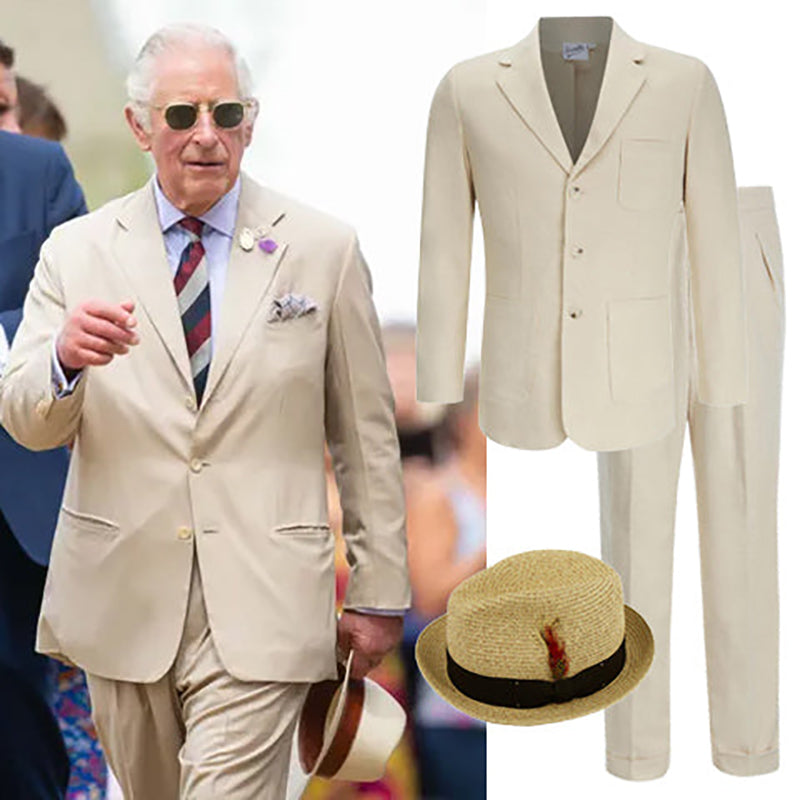 King Charles wearing a cream linen suit and a Panama hat