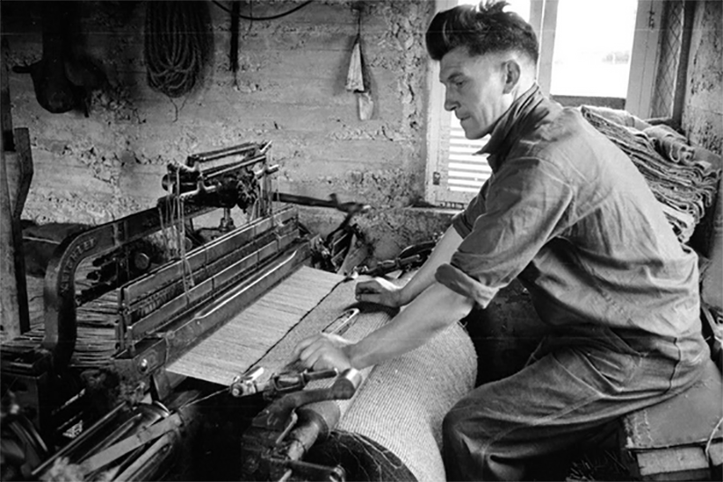 Worker manufacturing Harris Tweed