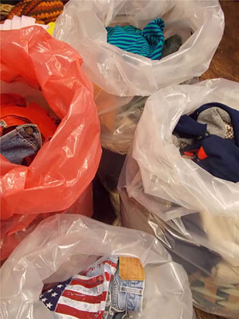 Second hand clothes in plastic bags