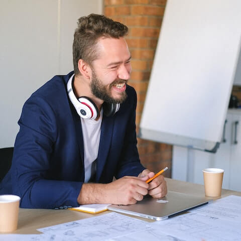 Creative entrepreneur business founder laughing in a meeting