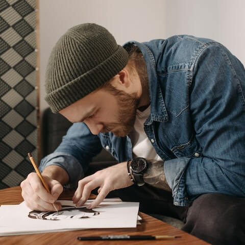 Creative entrepreneur, drawing a tattoo