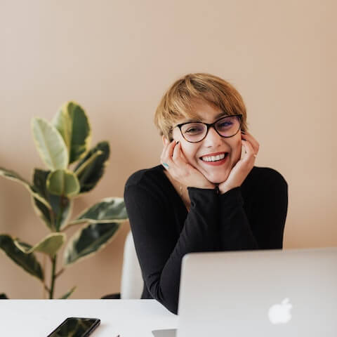 Creative entrepreneur sat at her laptop working