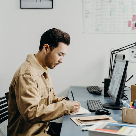 creative entrepreneur with ADHD working at his desk.jpg