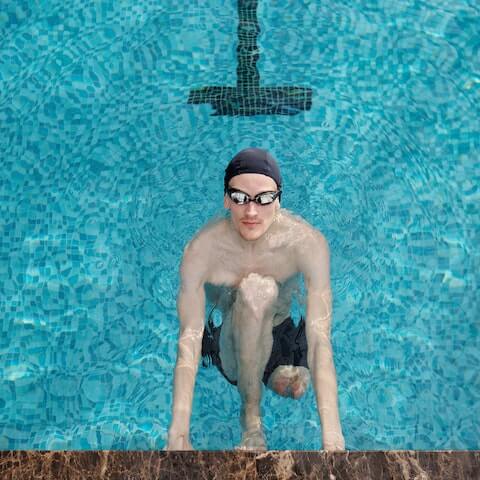 Creative founder in the swimming pool to boost his productivity