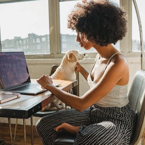 Creative lady sat at her desk planning her week