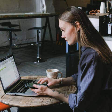 Creative lady working in coffee shop