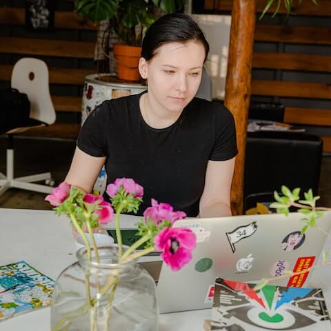 Female designer sat at her desk planning her week