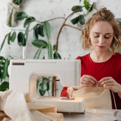 Seamstress using her creative mind to make clothing garments