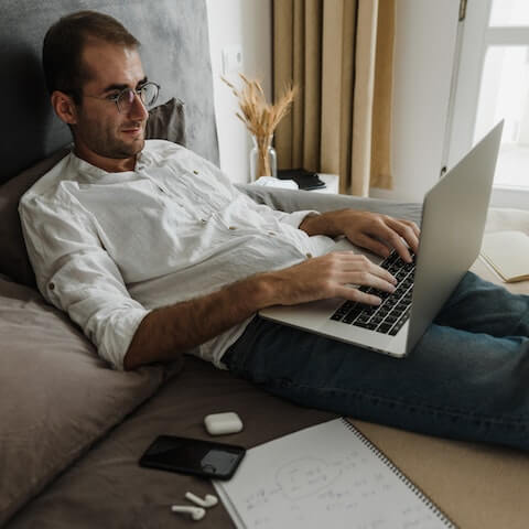 Stressed creative entrepreneur on his laptop