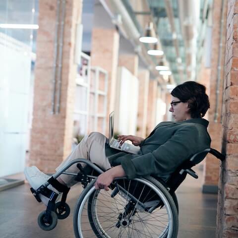 creative entrepreneur in wheelchair organising her work and personal life