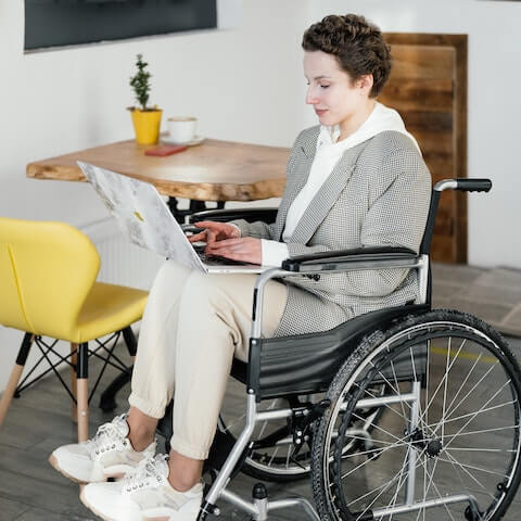 creative entrepreneur in wheelchair prioritising tasks