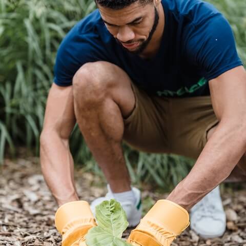 creative male practicing self care in his garden