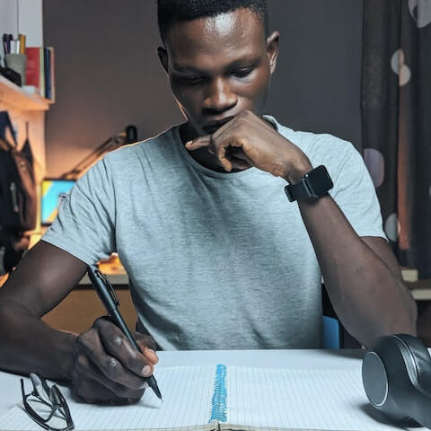 creative man writing organising his work and personal life
