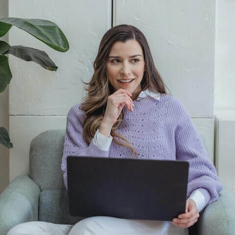 female creative entrepreneur working on macbook pro