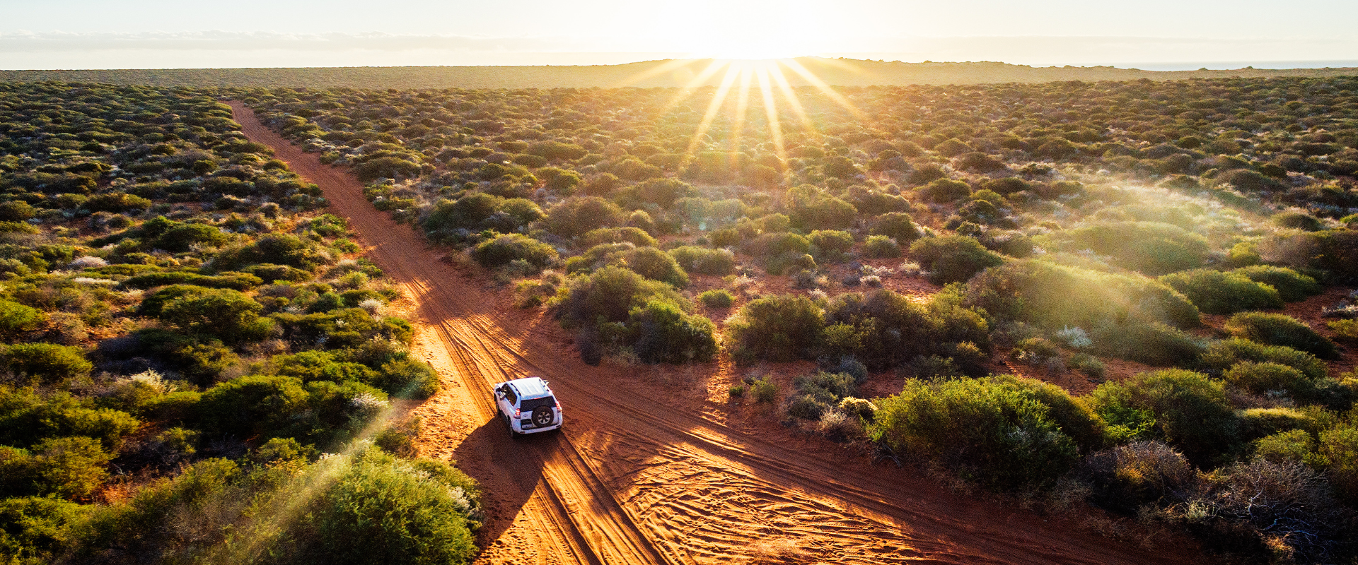 Driving off-road in Australia sunset