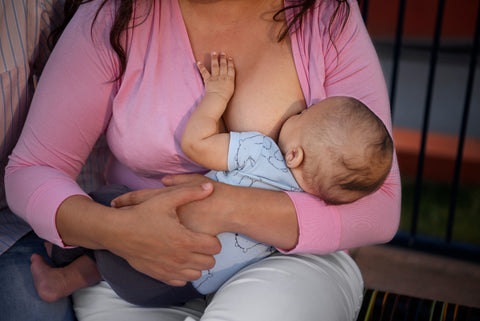 mother breastfeeding  baby