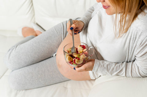 Pregnant lady eating a salad