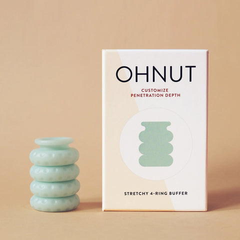 Classic Jade ohnut rings sitting stacked next to packaging