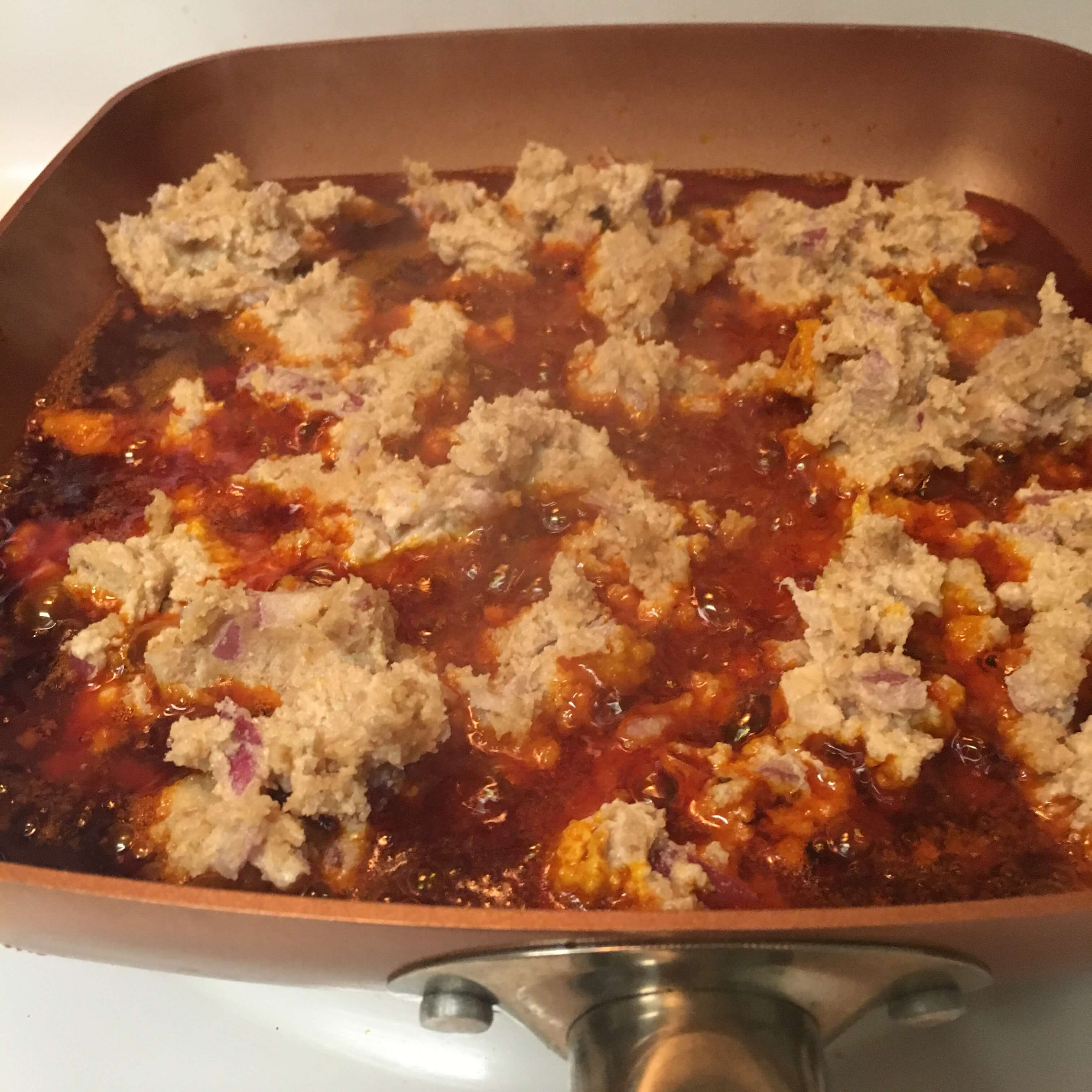 Egusi with Palm Oil in a Pan - Adun