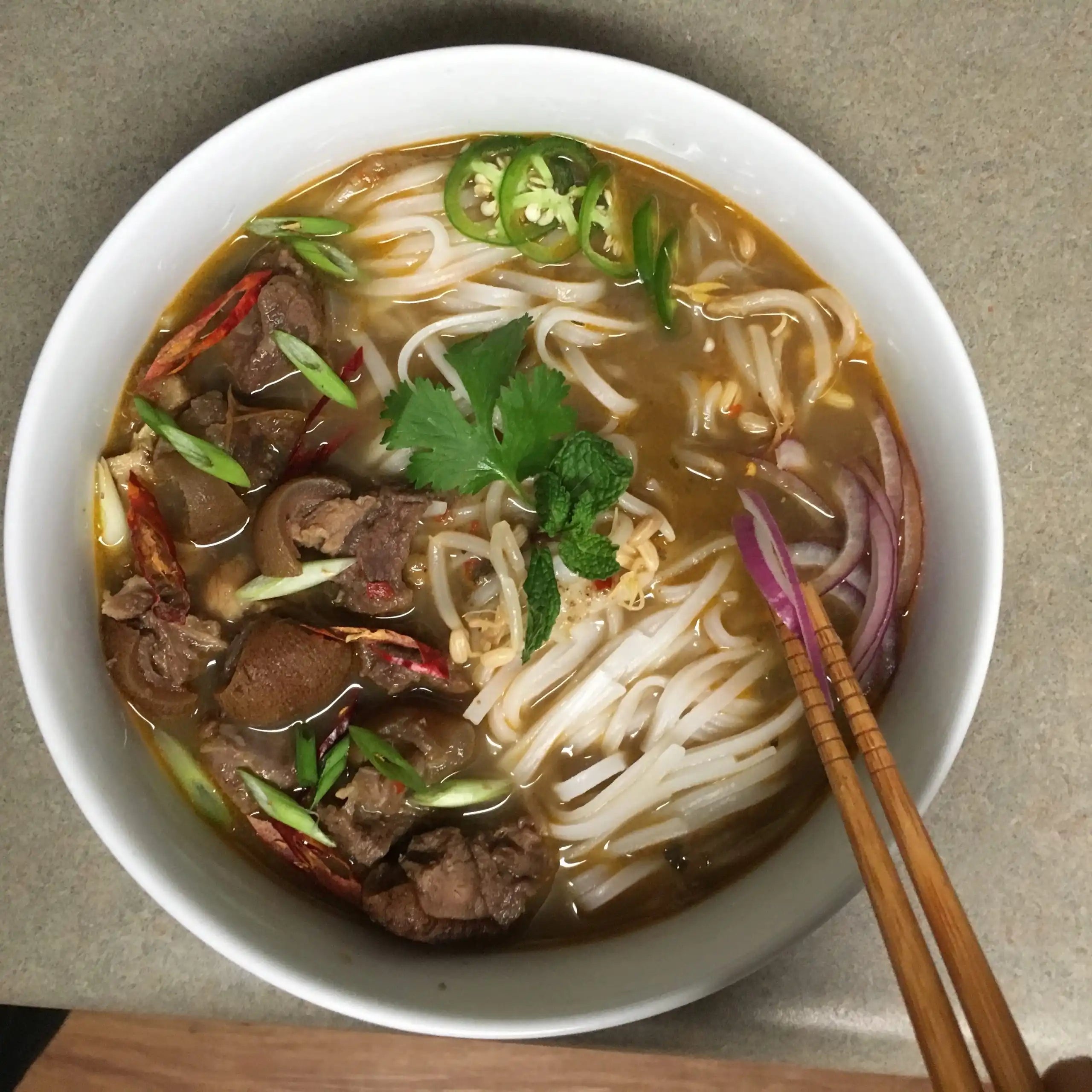 Goat Meat Peppersoup Pho with Garnish - Adun