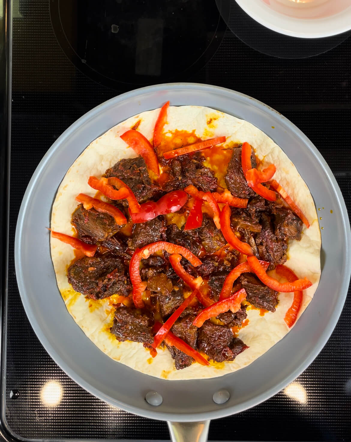 Stewed Beef, Bell Peppers and Tortilla in a Pan