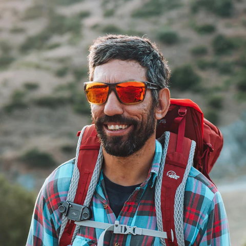 a man enjoying his hike wearing Torege unisex sunglasses