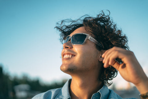 a man wearing Torege polarized sunglasses smiling