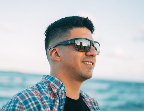 a man enjoying on a beach wearing Torege lifestyle sunglasses