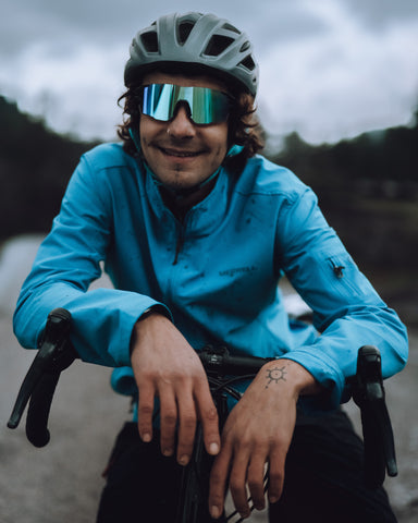 a cycling man wearing Photochromic Lenses