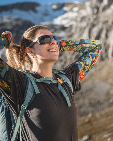 a girl wearing Torege sunglasses enjoying hiking landscapes