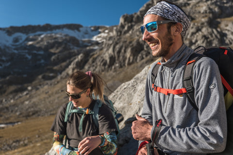 a man and a woman enjoying hiking views on the mountain wearing Torege hiking sunglasses