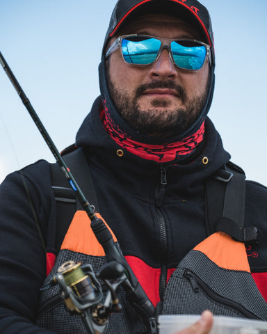 a fishing man wearing plastic frames sunglasses