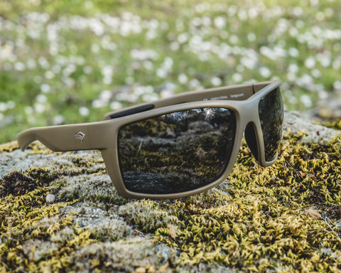 Torege Unique sunglasses model placed on the outdoor grassland