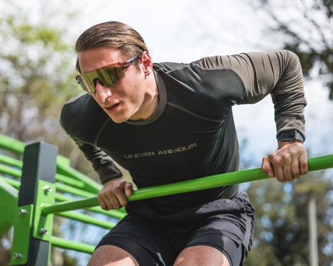 a man working out outdoors wearing Torege sports sunglasses