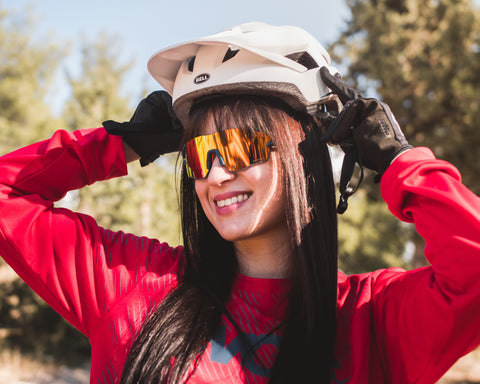 a cycling girl wearing Torege sports sunglasses