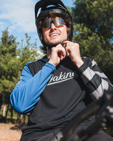 a man cyclist wearing Torege cycling sunglasses sitting on his bike