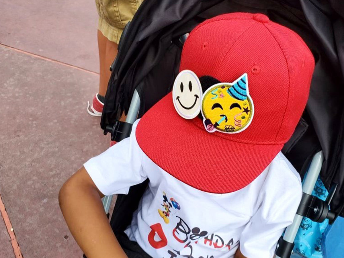 Little boy wearing 3D Xpressions hat with two patches on it