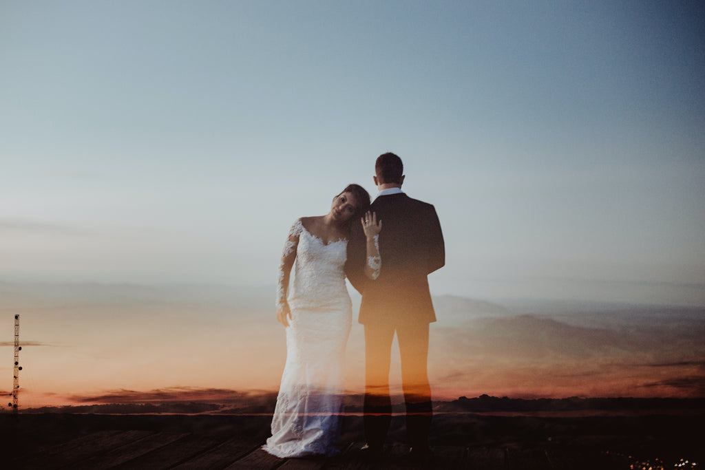 double exposure shot of bride and groom in a landscape background